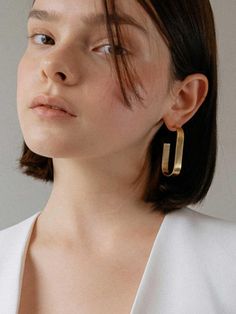 * Made to order item.(non-refundable)- Simple design- Bold thickness ring- Ring earringMeasurement- 2 x 0.3"- Weight: 0.3 ozComposition & Care- Silver925- 14K gold platingDesigner- Imported- by MCCOII- Style#: 300504112 Minimalist Oblong Earrings For Formal Occasions, Formal Minimalist Oblong Earrings, Modern Oblong Single Earring Jewelry, Contemporary Rectangular Gold Jewelry, Elegant Tarnish Resistant Oblong Earrings, Elegant Tarnish-resistant Oblong Earrings, Modern Rectangular Earrings For Anniversary, Modern Rectangular Pierced Jewelry, Elegant Single Oblong Earring