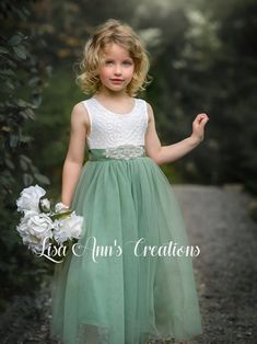 This beautiful dress is perfect for any special occasion. For a wedding, flower girl, junior bridesmaid, family pictures, a birthday party, and more. Lots of tulle colors available along with long sleeve, short sleeve, and sleeveless. find them all in my shop on Etsy. https://www.etsy.com/shop/LisaAnnsCreations Sage Flower Girl Dress, Green Flower Girl Dresses, Sage Green Flowers, Dress Sage Green, Sleeveless Flower Girl Dresses, Sage Bridesmaid Dresses, Rustic Flower Girls, Toddler Flower Girls, Sage Green Bridesmaid Dress