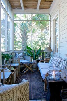 the porch is decorated with wicker furniture