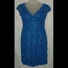 This Dress Is Size Large & Made By La Merchandise. It Measures About 19" Across The Bust, The Waist Measures 15 1/2", The Hips Measures 19 1/2" Across And It Is 38" In Length. It Is Fully Lined With A Tiered Lacy Overlay With Sequins On It To Give It Some Sparkle. It Also Has A Padded Bust, A Hidden Zipper Up The Side And A V-Neck In The Front And Back. It Is Made With 100% Polyester And Is Dry Clean Only. It Is New With The Tags Still On It, Might Have Some Wrinkling With Shipping. Very Pretty Blue Short Sleeve Mini Dress For Wedding, Fitted Royal Blue Lace Dresses, Fitted Blue Lace Dress, Fitted Blue Lace Mini Dress, Empire Waist Maxi Dress, Blue Cotton Dress, Sequin Midi Dress, Loft Dress, Floral Print Midi Dress