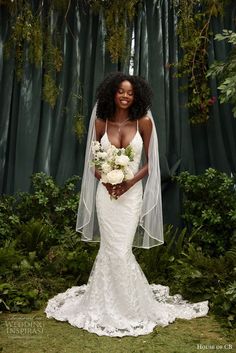 a woman in a wedding dress holding a bouquet