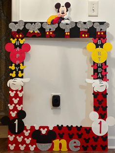 the mickey mouse frame is decorated with paper