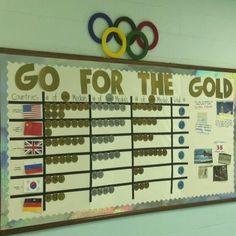 a bulletin board with an olympic theme on it and the words go for the gold