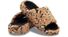 This new cozy Classic Slide features all over soft and fuzzy faux leopard fur. A roomy unisex fit and a deep heel cup makes them light and comfortable to wear. With the warm and cozy material and Croslite™ foam construction, these slide sandals are perfect for cooler days and nights.  Classic Leopard Fur Slide Details:    All over soft and fuzzy faux leopard fur  Incredibly light and fun to wear   Deep, cupped Croslite™ foam footbeds, offering sink-in comfort   Iconic Crocs Comfort™: Lightweight. Flexible. 360-degree comfort. Casual Soft Faux Fur Slippers, Brown Faux Fur Casual Slippers, Casual Faux Fur Slip-on Slippers, Brown Casual Faux Fur Slippers, Casual Brown Faux Fur Slippers, Casual Slippers With Faux Fur Lining, Slide Sandals, 360 Degree, Warm And Cozy