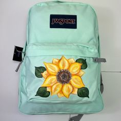 Jansport Superbreak Backpack In Brook Green With A Hand Painted Sunflower. Zipper Closure 13.5" Shoulder Drop 16.5" High 12" Wide All Items Are Individually Hand Painted With Washable Fabric Paint By Me. Jansport Superbreak Backpack, Brook Green, Jansport Backpack, Fabric Paint, Green Yellow, Sunflower, Bag Lady, Backpacks, Hand Painted