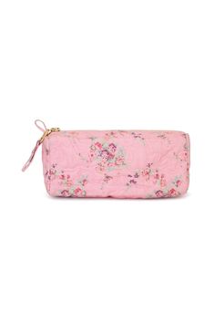 a pink flowered purse on a white background