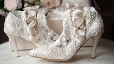 Classic Ivory Lace Wedding Boots and Shoes - House of Elliot Elegant Low Heel Wedding Shoes With Lace Trim, Elegant Pointed Toe Wedding Shoes With Laces, Pointed Toe Lace Wedding Shoes, Pointed Toe Wedding Shoes With Laces, Elegant Low Heel Lace-up Heels, Elegant Fitted Wedding Boots, Elegant Lace Wedding Shoes With Laces, Elegant Lace Wedding Shoes With Low Heel, Elegant White Formal Boots