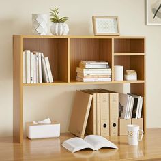 a book shelf with books and papers on it