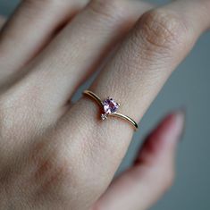 This 14K Pink Sapphire Heart ring makes for a perfect promise ring, or as a gift for your beloved. Nothing like saying "I love you" with this dainty beauty top with a natural white diamond. Perfect to wear alone or stacked with other ring bands. Available in 14k yellow gold, rose gold, and white gold. Pair it with our Siren Marquise ring or Winter Palace Marquise ring (as pictured) for the ultimate majestic look. This ring is designed and made in NYC. 14K solid gold band Natural pink heart sapph Dainty Diamond Birthstone Ring For Proposal, Dainty Heart-shaped Rose Gold Diamond Ring, Dainty Rose Gold Heart-shaped Diamond Ring, Dainty Rose Gold Heart Diamond Ring, Rose Gold Diamond Heart Ring For Proposal, Dainty Rose Gold Birthstone Ring With Diamond Accents, Dainty Birthstone Ring For Proposal, Delicate Rose Gold Heart Cut Ring, Heart-shaped Rose Gold Diamond Ring For Proposal