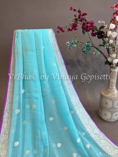 Sky blue and Purple Banarasi Chiffon Silk Saree and Blouse. Capture the captivating beauty of the season with this exclusive Sky blue and Purple Banarasi Chiffon Silk Saree and Blouse. This intricate garment is sure to make a statement of sophistication and luxury. Perfect for special occasions or everyday, add this piece to your wardrobe and experience the elegance and beauty of the highest quality. Blue Georgette Blouse Piece With Dupatta, Traditional Blue Organza Blouse Piece, Traditional Blue Organza Blouse, Blue Georgette Blouse Piece With Pallu, Designer Blue Cotton Silk Blouse Piece, Blue Semi-stitched Organza Blouse Piece, Blue Anarkali Blouse Piece For Eid, Blue Semi-stitched Georgette Saree, Designer Blue Organza Blouse Piece