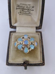 A STUNNING LARGE PEARSHAPE & ROUND CUT REAL OPAL & DIAMOND SET FLORAL CLUSTER RING. THE OPALS HAVE A LOVELY OPALESCENT FIRE TO THEM & BETWEEN EACH PEARSHAPE CUT OPAL ARE TWO REAL DIAMONDS SET. LOVELY DETAIL AND LOOKS FAB WHEN WORN. MARKED 9CT ON INSIDE AND HAS TESTED 9CT GOLD. ALL STONES TESTED AND GENUINE. RING SIZE uk N. IN EXCELLENT CONDTION. Molina Diamond Opal Ring, Luxury Opal Ring With Rose Cut Diamonds As Gift, Luxury Multi-stone Opal Ring Round Cut, Luxury Antique Opal Ring, Luxury Vintage Opal Ring With Diamond, Luxury Vintage Diamond Opal Ring, Luxury Antique Opal Ring As A Gift, Luxury Antique Opal Ring As Gift, Luxury Victorian Opal Gemstone Ring