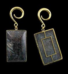 two square shaped gold earrings with black stone in the front and back, on a black background