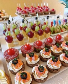 an assortment of appetizers are displayed on a table