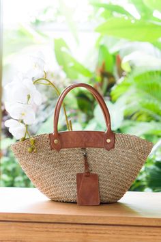 Seagrass Everyday Handbag Vacation Bag Unique Holiday accessory French Market Basket Natural bag Modern Boho style large tote shopping bag with a natural color, the bag is flexible for any outfit absolutely eco-friendly, handmade beach basket bag made of Seagrass and genuine leather handles leather color in caramel brown and dark brown color.  The straps are thick and durable. The bag is perfect for everyday wear in the city as well as for shopping or going to the beach. The tote Bag will add charm to your everyday look.   ● Material: Seagrass, leather, Calico Lining, Zipper ●Quantity listed: 1pc ●Dimension: Length: 48-50 cm Height: 28-30 cm Height of handles: 28-30 cm, Bottom Width - 30 cm Color available: 1pc brown leather only ●PACKING: We'll wrapped it in single face corrugated paper, Modern Boho Style, French Market Basket, Beach Basket, Vacation Bag, Everyday Handbag, Market Basket, French Market, Rattan Bag, Market Baskets