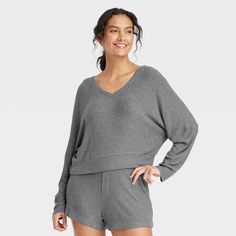 Stay effortlessly comfortable as you lounge around the house in this Cozy Ribbed Pullover from Auden™. Made from lightweight, super-comfy soft-brushed rib fabric with spandex, this long-sleeve pullover top hits at the hip. Designed with a V-neck and a relaxed fit, it's sure to be your new fave lazy-day pick. Auden™: Comfort true to every shape & hue. Comfy Ribbed Loungewear Sweater, Cozy Ribbed Sweater For Loungewear, Snug Solid Sweater For Loungewear, Ribbed Loungewear Sweater, Snug Sweater With Ribbed Cuffs For Loungewear, Solid Color Ribbed Sweater For Loungewear, Gray V-neck Sweater For Loungewear, Comfortable Soft Knit Tops In Solid Color, Cozy Fit Tops With Soft Texture For Loungewear