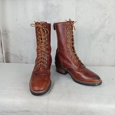 Great pair of packer, logger, work boots made by the Georgia Boot Company in the USA. Brown leather uppers with 11 rows of laces holes and hooks. 9 1/2 inches tall plus a 2 inch heel. Vibram soles. Very nice condition. Notice the picture of the solesvery little wear.  Stamped men's size 8 W (wide width).     Measurements: Sole length   11 inches Sole width     4 inches Logger Boots, Georgia Boots, Boot Companies, Grand Junction, Mens Cowboy, Men Formal, Cowboy Western, Mens Shoes Boots, Western Cowboy Boots