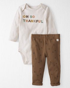 A simple holiday playwear set that's perfect for the fall season. Featuring a long-sleeve bodysuit with a sweet slogan and cozy ribbed pants to match, you can dress your little one in this 2-piece that's made for holiday memories. Crafted in the purest organic fabrics and sustainable materials, Little Planet is a return to simplicity. Thoughtful essentials and timeless pieces to gift or to hold on to. Cute Long Sleeve Bodysuit For Fall, Casual Ribbed Sets For Fall, Brown Long Sleeve Sets For Fall, Long Sleeve Brown Sets For Fall, Brown Cotton Sets For Fall, Fall Brown Cotton Sets, Long Sleeve Bodysuit For Loungewear In Fall, Brown Loungewear Sets For Fall, Casual Cotton Bodysuit For Winter