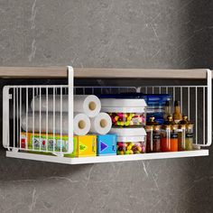 a shelf filled with lots of different types of food and condiments on it