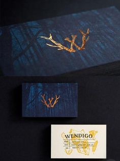 the business card is designed to look like it has gold leaves on it and blue background