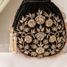 Black Velvet Potli Bag, Zardozi Katdana Sequin Embroidery Evening Bag for Wedding, Handmade Drawstring Purse, Bridesmaid Gifting Small Purse Size  : 10 x 8 Inches Pacakge Content : 1 Pcs Designed with the heart, this beautiful Potli or batawa bag are eye catchy and made of premium material. Key Features: Embroidery art work This potli is good match with both Indian and western outfits and are superb for wedding and festive parties This would be best complement to your designer saree, lenhga or any other kind of dress This is the combination of traditional and modern embroidery work This is enough to keep your accessories and all needed essentials and it can be a best gift for any woman. Festival Bags With Floral Embroidery For Reception, Festival Bags With Floral Embroidery, Floral Embroidered Bags For Festivals And Receptions, Floral Embroidered Bags For Receptions And Festivals, Festival Potli Bag With Gold Embroidery For Receptions, Gold Embroidered Potli Bag For Receptions And Festivals, Embroidered Evening Bag For Diwali Party, Festive Potli Bag With Gold Embroidery For Reception, Reception Potli Bag With Gold Embroidery For Festivals