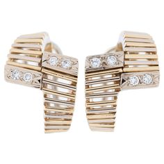 These Art Deco Italian earrings are a stunning example of 1920s and 1930s design aesthetics. They are crafted from 18kt yellow and white gold and are adorned with diamonds, displaying intricate openwork and a distinct geometrical shape. The use of 18kt gold indicates a high level of craftsmanship and quality. Yellow and white gold are often combined in Art Deco jewelry to create striking contrasts. White gold provides a brilliant, silvery background against which the diamonds and other design el Classic Yellow Gold Diamond Earrings For Evening, Timeless Hallmarked Diamond Earrings For Formal Occasions, Classic Formal Diamond Earrings With Polished Finish, Classic Diamond Earrings With Polished Finish For Formal Events, Classic Diamond Earrings With Polished Finish For Formal Occasions, Timeless Yellow Gold Diamond Earrings For Formal Occasions, Art Deco White Gold Diamond Earrings With Brilliant Cut, Timeless Formal Earrings With Single Cut Diamonds, Art Deco Diamond Earrings Hallmarked