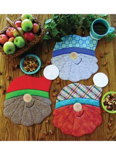 the table is covered with various items to make it look like gnomes and apples