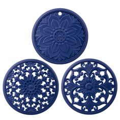 three blue coasters with an intricate design on them, one is round and the other has