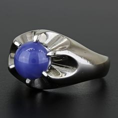 Vintage 14k White Gold Linde Lindy Blue Star Sapphire Cocktail Anniversary Ring This Ring Is Made Of 14 Karat White Gold & Displays A Large Blue Linde Sapphire. This Beautiful Stone Is Held By The White Gold Prongs That Form A Unique, Wave-Like Design Around The Stone. "14k" Is Stamped Onto The Ring's Band. This Ring Can Be Resized By Any Qualified Jeweler. Size: 8.25 Band Width: 3.9 Mm Metal: 14 Karat White Gold Weight: 6.72dwt // 10.45 Grams Gemstone: Linde Blue Star Sapphire 785299-1* E-343 Blue Cabochon Sapphire Ring In Fine Jewelry Style, Fine Jewelry Blue Cabochon Sapphire Ring, Blue Cabochon Ring In Fine Jewelry Style, Blue Cabochon Sapphire Ring In 14k Gold, Blue Cabochon Fine Jewelry Ring, Fine Jewelry Blue Cabochon Ring, Blue Platinum Jewelry Gift, Blue Celestial Ring With Center Stone, Modern Blue Sapphire Ring Hallmarked