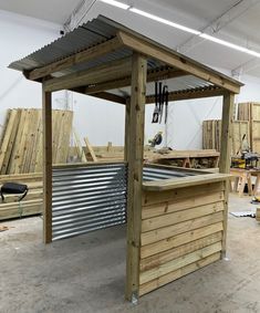 an outdoor kitchen made out of pallet wood and steel is shown in this image