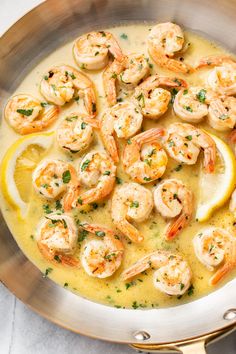 a pan filled with shrimp and lemon sauce