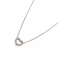 Material: 18k white gold  Hallmark: Tiffany & Co. 750  Measurement: Chain: 16.25" long  Pendant: 0.29" long x 0.31" wide  Diamond: 8 points     Weight: 2 grams    This is a lovely authentic necklace by Tiffany & Co. from the METRO collection. It features a mini heart pendant adorned with 7 points diamond, it comes with a classic link chain and is signed by the designer with the metal content. Heart Pendant Gold, Long Pendant, Mini Heart, Heart Pendant Necklace, Heart Of Gold, Tiffany & Co., Heart Pendant, White Gold, Things To Come