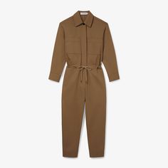 The Carr is part utility jumpsuit, part chic statement piece. Made from an Italian organic cotton chino, this style features generous pockets, a drawstring at the waist, a hidden placket, and an easy fit. Ideal for days when you need to be ready to go in seconds flat. Belted Utility Jumpsuit For Workwear, Utility Belted Jumpsuit For Workwear, Cotton Jumpsuits And Rompers With Side Pockets For Fall, Cotton Jumpsuits With Side Pockets For Fall, Utility Style Belted Jumpsuit For Fall, Cotton Jumpsuits And Rompers For Work With Tie Waist, Relaxed Fit Cotton Jumpsuits And Rompers With Tie Waist, Relaxed Fit Cotton Jumpsuit With Tie Waist, Chic Cotton Jumpsuits And Rompers For Work