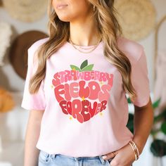 "If you're someone who loves the taste and smell of fresh strawberries, then you know just how magical a strawberry field can be. This \"Strawberry Fields Forever\" short sleeve crewneck is the perfect gift for cottagecore lovers, foodies, gardeners and to wear during the Spring/Summer or even year round! The design is both playful and sophisticated, making it perfect for casual wear or for dressing up for a day out with friends. So if you're a strawberry lover looking for a stylish and comfortable way to show off your passion, our shirt is the perfect choice! See below for more product details:  🛒 PRODUCT - The design for this product will be printed on Bella+Canvas 3001 Brand Shirts - Unisex Adult Sizing (XS / S / M / L / XL / 2XL) - Check size chart. Unisex t-shirts are intended to be Strawberry Field, Strawberry Shirt, Strawberry Fields Forever, Summer Closet, Gardening Gift, Shirt Aesthetic, Brand Shirts, Strawberry Fields, Strawberry Print