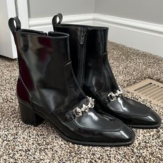 Bought Last Year And Never Wore Perfect Boot For A Trip To Europe Or Vegas Has Small Marks From Closet As Shown But Have Since Been Stored In Box Do Not Have Original Box/Dustbag Euro Size Is 38.5 Formal Boots With Chain And Round Toe, Formal Black Boots With Chain Detail, Formal Black Boots With Chain, Black Boots With Chain Strap For Formal Occasions, Black Patent Boots, Trip To Europe, Patent Boots, Christian Louboutin Shoes, Bootie Boots