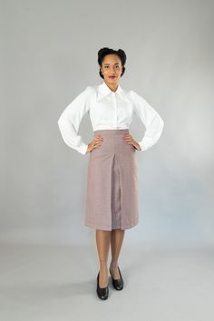 Wide-cut, calf-length skirt with a wide waistband in 40s style. It has a deep box pleat at the front and back. The skirt is lined, All models are made in my studio in Berlin. Outer fabric: 100% virgin wool Dry cleaning Size 34: Bust 80 cm, waist 64 cm, hips 86 cm Size 36: Bust 84 cm, waist 68 cm, hips 90 cm Size 38: Bust 88 cm, waist 72 cm, hips 94 cm Size 40: Bust 92 cm, waist 76 cm, hips 98 cm Size 42: Bust 96 cm, waist 80 cm, hips 102 cm Size 44: Bust 100 cm, waist 84 cm, hips 106 cm Size 46: Fitted Pleated Skirt With Accordion Pleats For Workwear, Classic Fitted Midi Skirt, Fitted Accordion Pleats Skirt For Workwear, Classic Daywear Pleated Skirt, Fitted Midi Skirt With Accordion Pleats, Accordion Pleated Midi Skirt, Classic Fitted Midi Pencil Skirt, Fitted Flared Pleated Skirt For Formal Occasions, Fitted Full Pleated Skirt With Pleated Waist