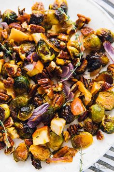 roasted brussel sprouts and brussels sprouts on a white plate