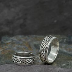 "A solid traditional Celtic knot band with a connected pattern all way around, symbolising the Celtic belief in the continuity of life. Sterling silver with an oxidised finish to highlight the intricate details. A wide range of sizes are available - for mens rings, women rings, thumb ring, wedding bands, engagement rings and couples rings. This Celtic knot ring features intricate lines that connect all the way around the ring. Our Continuous Celtic Knot ring has an oxidised finish which shows off the Celtic knotwork design.  It is perfect for a Celtic style engagement or wedding and everyday mens ring.  Width: 8mm Weight: 8-10gr * Select ring size when ordering - check our if unsure * Buyer responsible for postage if exchange in size required * Comes Gift boxed with explanation card * Ship Celtic Knot Ring Mens, Celtic Wedding Band Set, Celtic Knotwork Design, Celtic Knot Band, Celtic Band, Couples Rings, Celtic Wedding Bands, Rings Women, Celtic Knot Ring