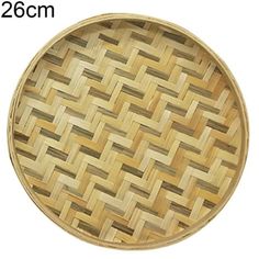 a round wooden tray with woven design