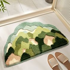 a pair of slippers sitting on top of a rug next to an open door