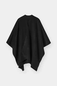 Indulge in luxury with our cashmere cape crafted in our signature double faced fabric. The perfect piece to transition your wardrobe with this season. Layer over our silk essentials, paired with our denim and ballet flats for an effortless work to weekend look. Chic Black Oversized Cape, Chic Oversized Black Cape, Black Cape Poncho For Work, Black Workwear Poncho Cape, Chic Black Cape For Workwear, Chic Black Cape For Fall, Chic Black Fall Cape, Black Workwear Cape, Elegant Oversized Black Cape