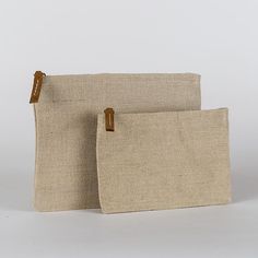 Jute is an amazing natural and sustainable material, so we made a set of zippered pouches in a size that works well for so many things. With a striped cotton lining and leather pull, it's perfectly elegant on its own or as an organizer in your bag or backpack. Set of two. Everyday Beige Zipper Pouch, Everyday Beige Pouch With Zipper Pocket, Natural Rectangular Everyday Pouch, Everyday Natural Rectangular Pouch, Eco-friendly Everyday Rectangular Pouch, Daily Use Beige Pouch With Zipper Pocket, Eco-friendly Natural Color Pouch For Everyday, Eco-friendly Zipper Pouch Bag, Eco-friendly Everyday Cosmetic Pouch Bag