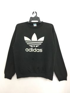 "SVS 494 Sale!! 80s ADIDAS Trefoil Sweatshirt Big Logo Large Size Made In Usa Black Color SIZE ON TAG ( L ) MEASURES ABOUT (APPROXIMATELY) : - ARMPIT TO ARMPIT: 23 inch - LENGTH (BACK COLLAR DOWN): 27 inch - SLEEVES: 25 inch - Condition 7/10 (please refer picture) - Slightly faded (PLEASE CHECK MEASUREMENT CAREFULLY) ----------------------------------- Payment : Accept \"PAYPAL\" Only Please contact to me with any questions. Thank you very much for  watching my item. Please come again & have a n Record Label Logo, 80s Throwback, 80s Adidas, Team Sweatshirts, Adidas Sweater, Black Jumper, College Sweatshirt, Adidas Trefoil, Adidas Outfit