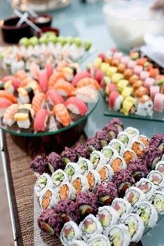 various types of sushi displayed on trays