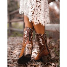 DOUBLE D RANCH BY OLD GRINGO - WOMEN'S Here is your ultimate multi-tasker for work or play – this mid-calf boot adds a western edge to your wardrobe, ups your boho dressing game, and adds a bit of bling to your step with it's engraved silver heel cap. The Cattleman Boot will be one of the most hardworking pieces in your wardrobe. Toe: snip Leather: leather, contrast leather Heel: engraved silver heel caps (3.19") Shaft: 7" Features: nail heads, western stitching Closure: back zipper Fitted Boots For Fall Festival, Wide Calf Brown Mid-calf Boots For Fall, Brown Wide Calf Mid-calf Boots For Fall, Western Style Winter Moto Boots For Rodeo, Leather Boots For Fall Festival, Fall Festival Leather Boots, Western Style Moto Boots For Rodeo In Winter, Western Style Moto Boots For Winter Rodeo, Fall Season Moto Boots With Round Toe For Rodeo