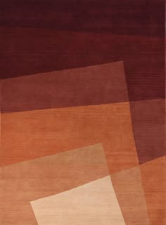 an area rug with different colors and shapes on the floor, including brown, red, orange, beige, and white