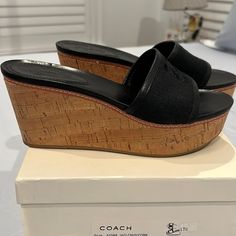 Coach Wedges Size 7.5 Black Linen With Leather And Cork Wedge Never Worn Black Wedge Sandals With Textured Sole, Black Textured Sole Wedge Sandals, Casual Coach Platform Wedge Sandals, Black Wedge Sandals With Contrasting Heel And Round Toe, Coach Leather Platform Wedge Sandals, Coach Black Heels With Removable Insole, Designer Black Platform Wedge Sandals, Coach Wedges, Coach Shoes