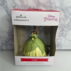 the princess and the frog ornament in its box