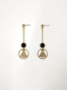 These earrings are inspired by the geometric patterns characteristic of the Art Deco era. Polished, semi precious black agate stone feature at the centre, contrasting with the surrounding warm, golden brass.  The bold lines and symmetry of the design are simultaneously classic and contemporary.  Held by a solid brass stud with stainless steel earring post.  Approximate measurements- 6.75cms long 2cms wide  ✨All Set Theory jewellery comes with care instructions and a polishing pad to keep your je Luxury Gold Art Deco Earrings, Luxury Brass Art Deco Jewelry, Luxury Art Deco Brass Jewelry, Contemporary Precious Stone Earrings, Luxury Black Art Deco Earrings, Set Theory, Gold Art Deco Earrings, Black Dangle Earrings, Black Agate Stone