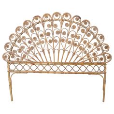 a metal headboard with an intricate design