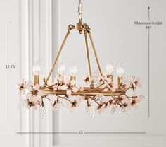 a chandelier with pink flowers hanging from it's center and four lights on each side